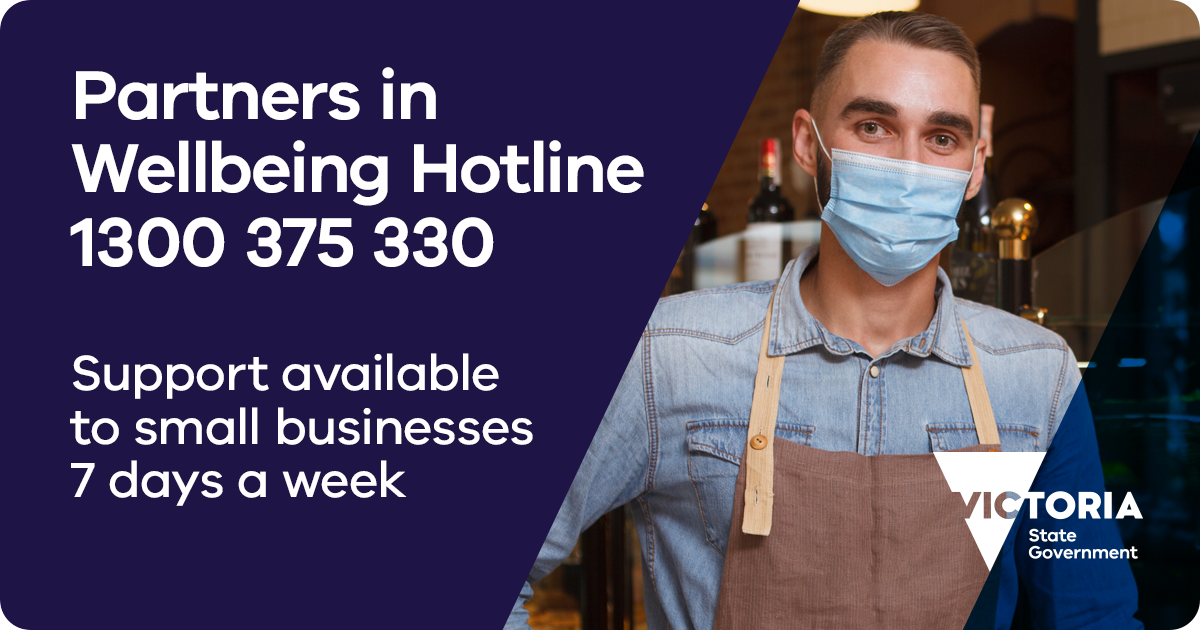 Image with small business owner in a mask and apron with the text "Partners in Wellbeing Hotline 1300 375 330 Support available to small businesses 7 days a week".